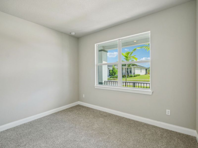 Bedroom in the Onyx floorplan at 6406 NW Sweetwood Drive