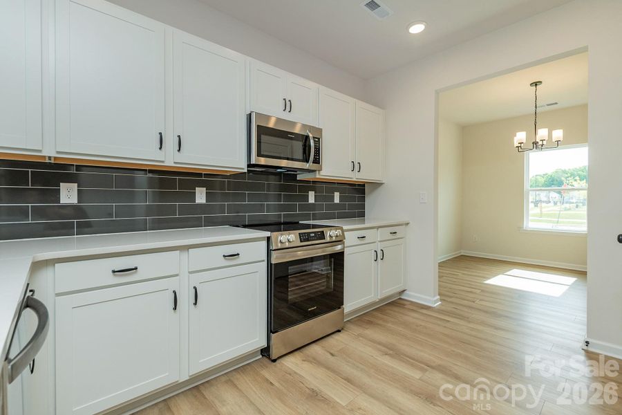 Furnished interior view inside a new home in Country Club Village, Salisbury (Image 9).