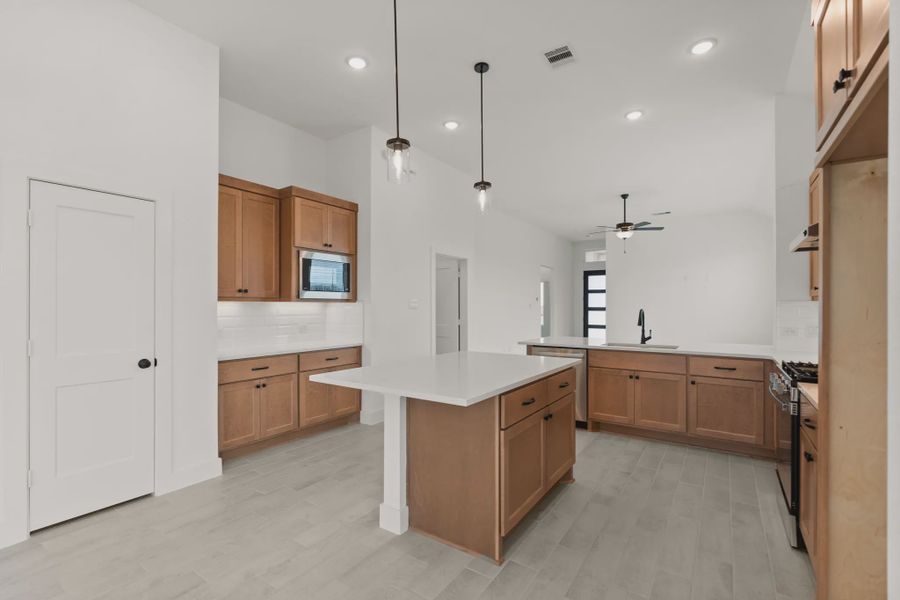 Representative furnished interior of a home built from the Pinehurst by Chesmar Homes in Riceland Alley Loads, Mont Belvieu (Image 5).