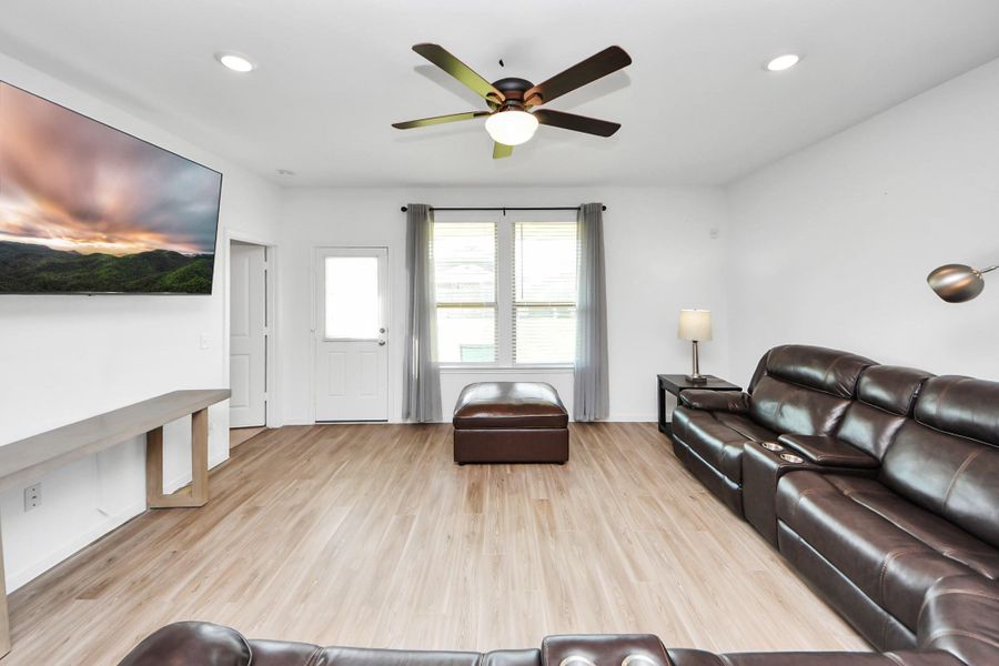 Greeted by open floor plan kitchen/dining/living area