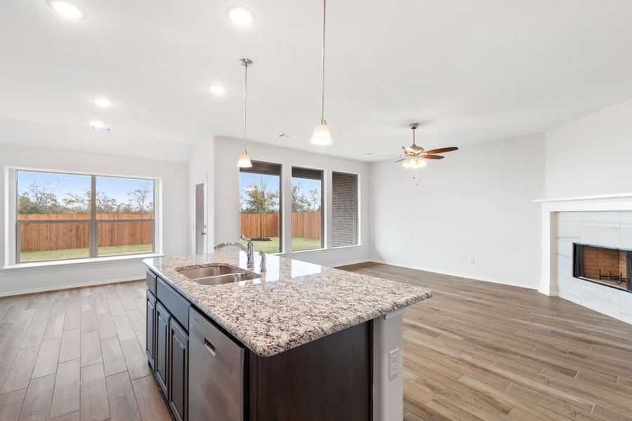 Kitchen & Family Room | Concept 1660 at Hunters Ridge in Crowley, TX by Landsea Homes