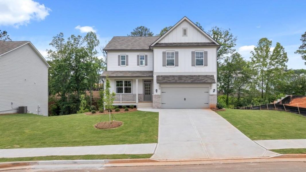 Front exterior of a new home in Thompson Ridge, Dallas, GA, highlighting curb appeal (Image 1). Front exterior of a new home in Thompson Ridge, Dallas, GA, highlighting curb appeal (Image 1).