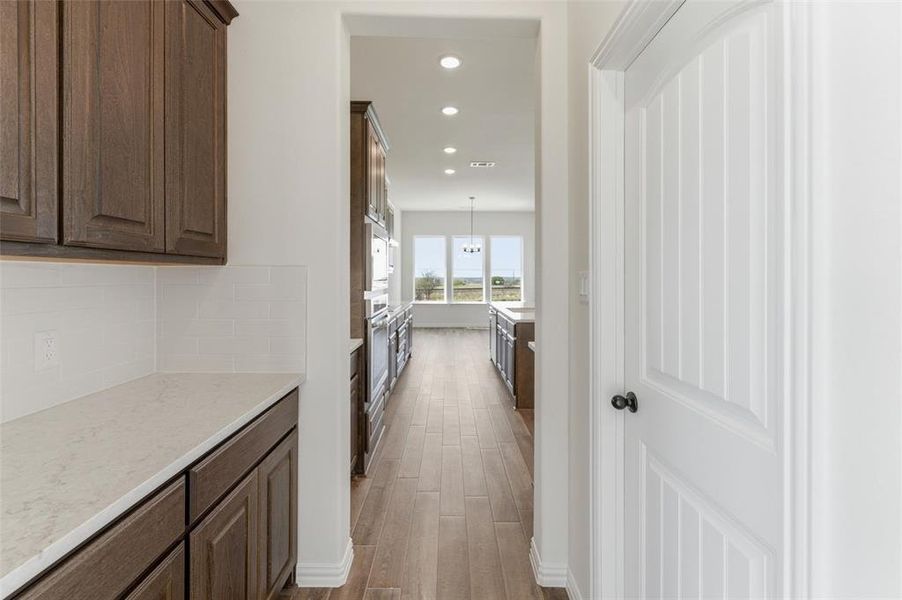 Hall featuring recessed lighting and dark wood-type flooring Hall featuring recessed lighting and dark wood-type flooring