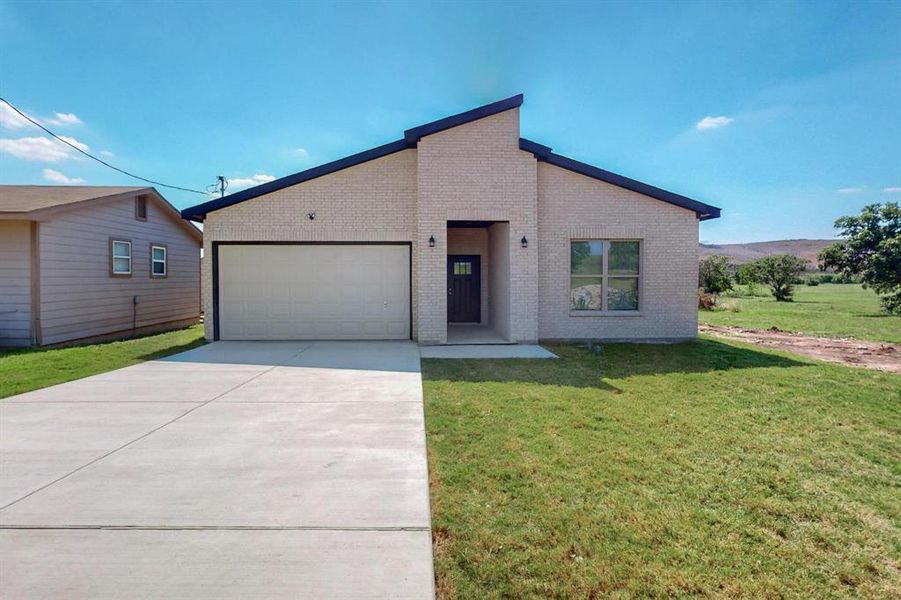 View of front of house with a front lawn