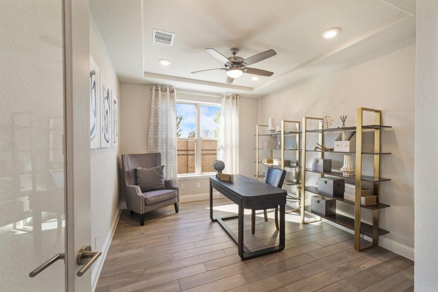 Furnished interior view inside a new home in Ellwood, Iowa Colony (Image 9).