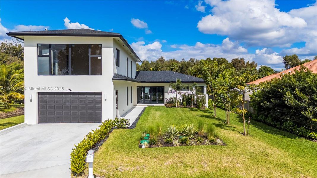 Front exterior of a new home in , Plantation, FL, highlighting curb appeal (Image 2).