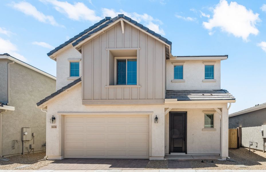 Front exterior of a new home in Asante- Atrium Series, Surprise, AZ, highlighting curb appeal (Image 20).