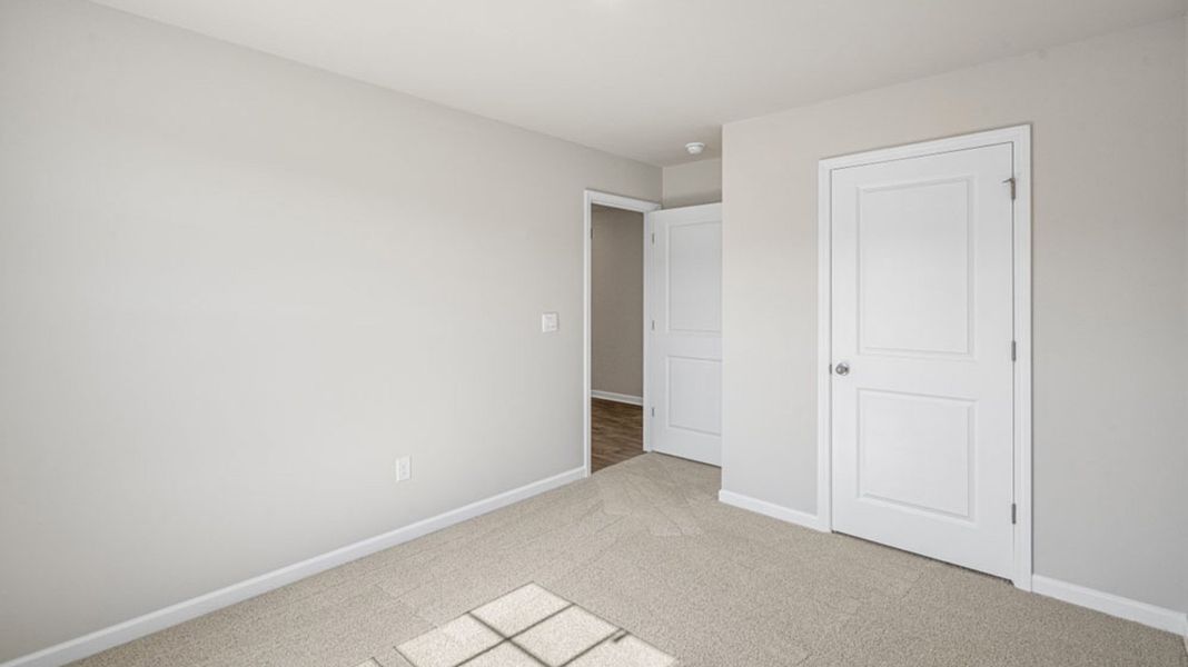 Representative unfurnished interior of a home built from the FREEPORT by D.R. Horton in River's Edge, Mayodan (Image 8).