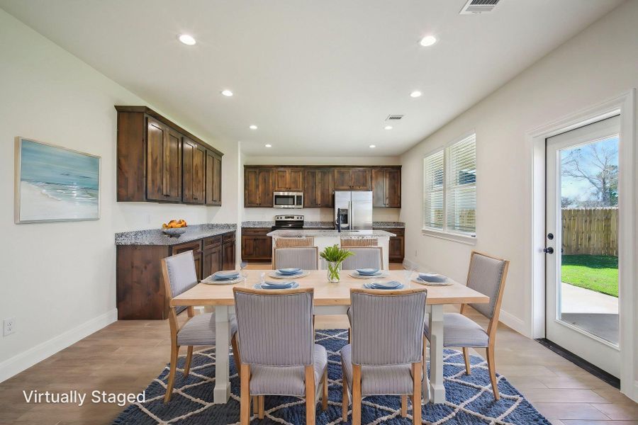Virtually Staged Dining space with baseboards, light wood-type flooring, visible vents, and recessed lighting Virtually Staged Dining space with baseboards, light wood-type flooring, visible vents, and recessed lighting