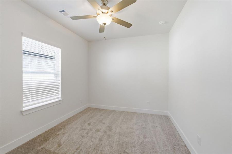 Neutral-toned carpeting paired with crisp white walls