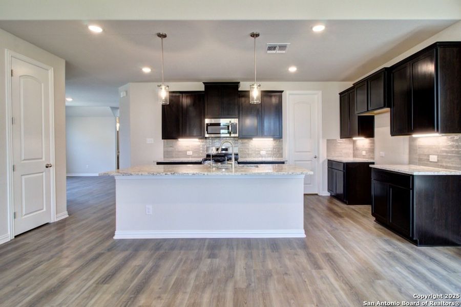 Furnished interior view inside a new home in Stream Waters, Seguin (Image 8).