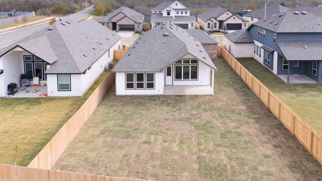 Exterior details and patio area of a home in Carillon, Manor (Image 18).