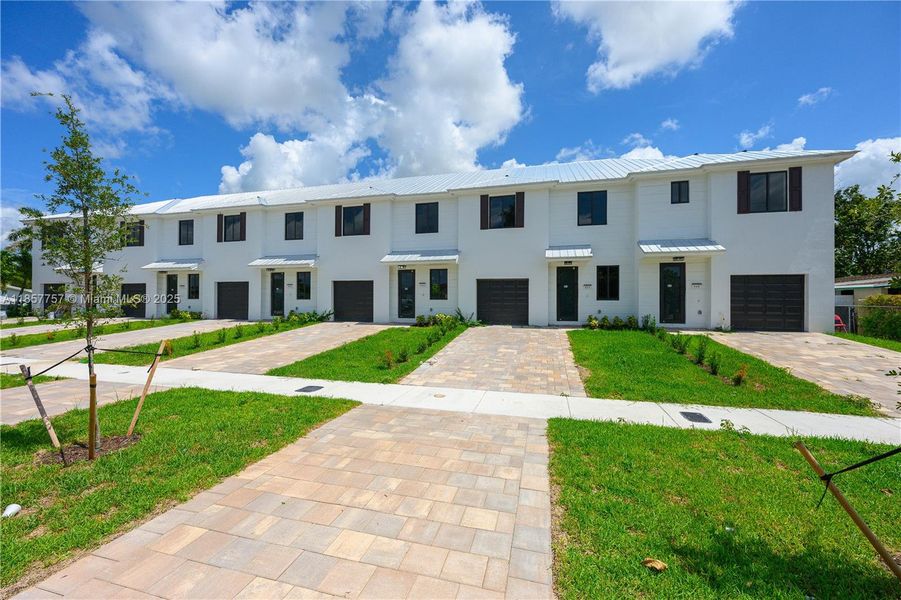 Front exterior of a new home in , Florida City, FL, highlighting curb appeal (Image 20). Front exterior of a new home in , Florida City, FL, highlighting curb appeal (Image 20).