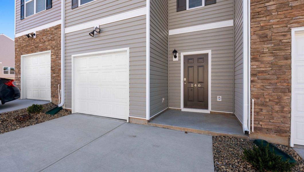 Front exterior of a new home in Brookside Ridge Townhomes, Greer, SC, highlighting curb appeal (Image 2).