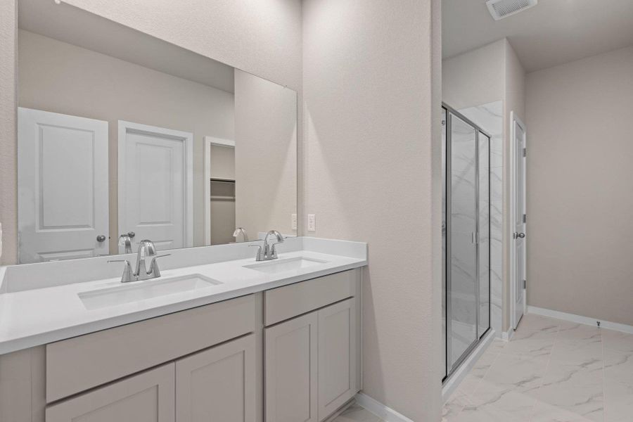 Primary Bath retreat with dual vanities & walk-in shower Primary Bath retreat with dual vanities & walk-in shower