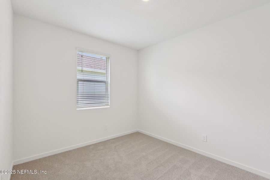 Spacious, unfurnished interior of a new home in Colbert Landings, Palm Coast (Image 23).
