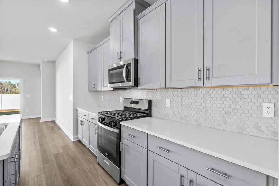 Furnished interior view inside a new home in Cypress Ridge - The Boardwalk Series, Longs (Image 7).