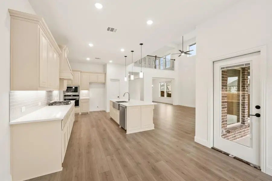 Furnished interior view inside a new home in Villages of Hurricane Creek, Anna (Image 7).