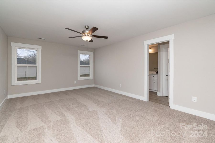 Large Primary Bedroom that includes a Spacious Walk-in Closet and Lots of Natural Light