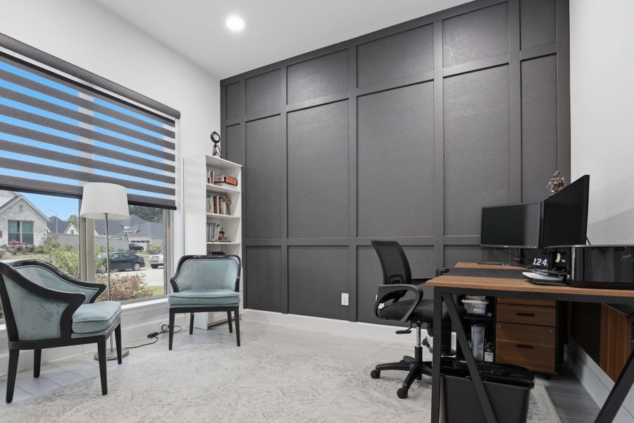 This perspective highlights the newly installed Zebra blinds, providing versatile light control for the home office.