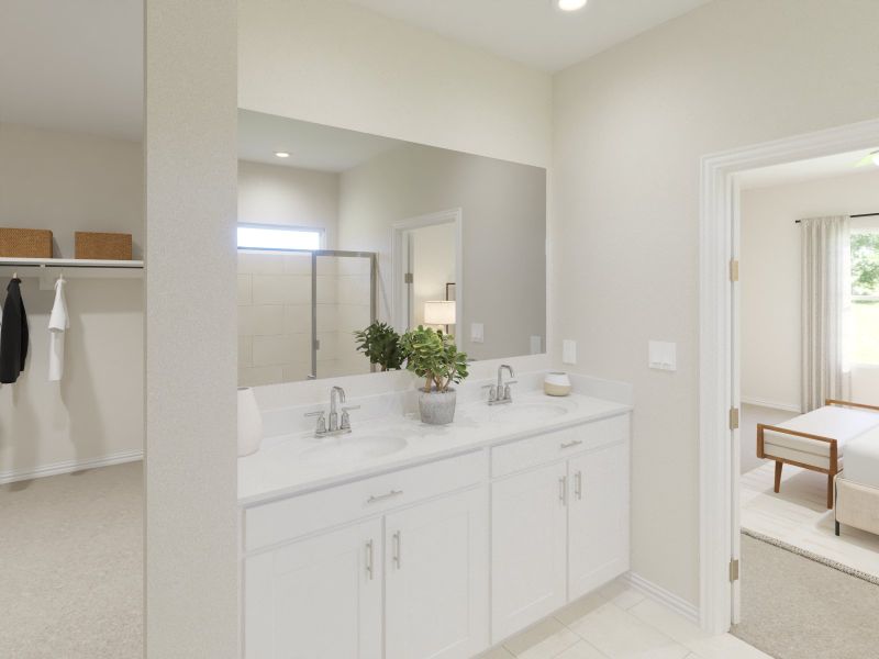 Primary bathroom with double vanity and large walk-in closet Primary bathroom with double vanity and large walk-in closet