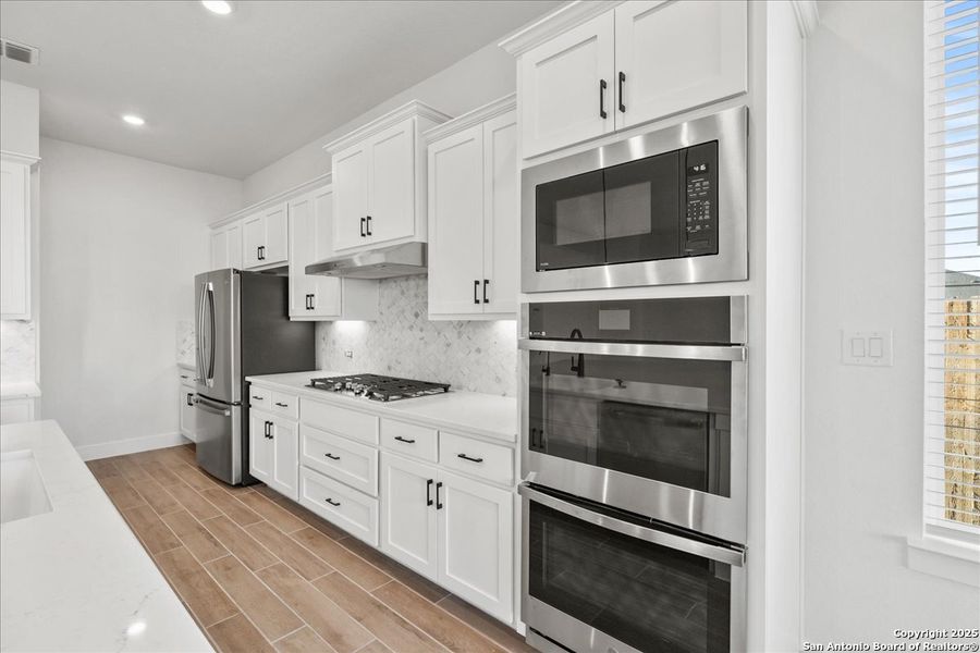 Furnished interior view inside a new home in Village at Three Oaks, Seguin (Image 6).