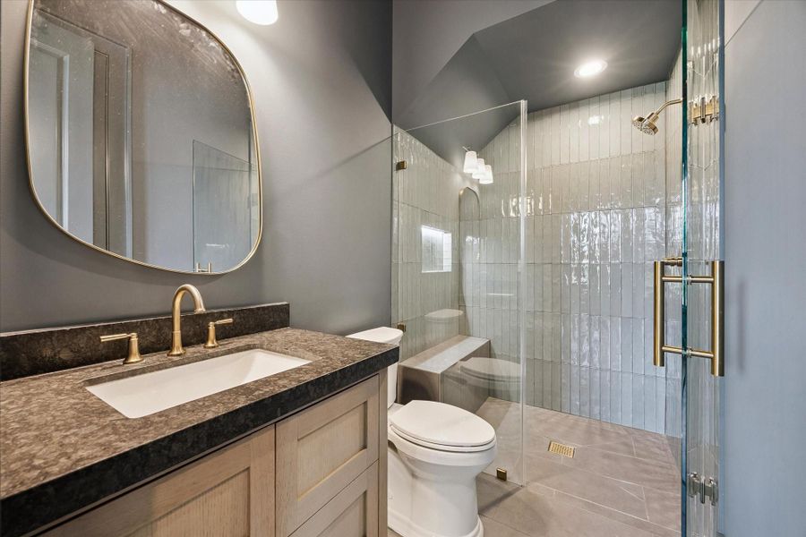 5th bedroom full bath en-suite   *photos are of a previously constructed home by the builder. 1248 Chamboard may have different selections at builders sole discretion. These photos are not meant to be an exact representation of 1248 Chamboard.