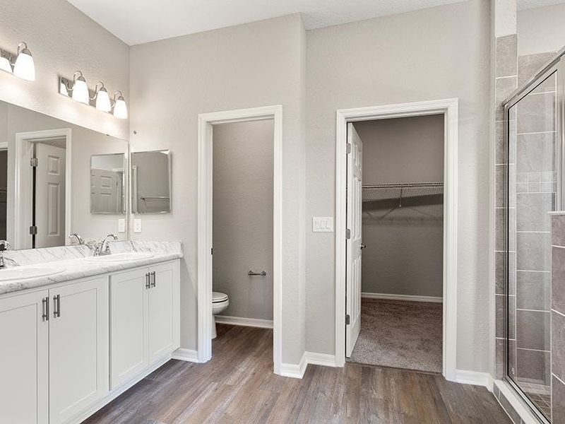 The owner`s suite includes a luxurious en-suite bath - Willow II by Highland Homes The owner`s suite includes a luxurious en-suite bath - Willow II by Highland Homes