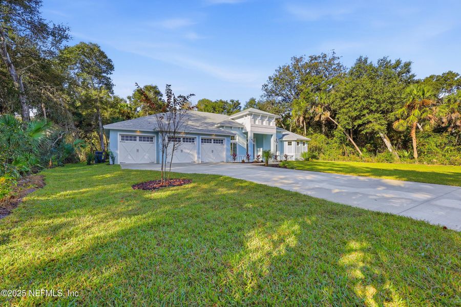 Front exterior of a new home in , Flagler Beach, FL, highlighting curb appeal (Image 2). Front exterior of a new home in , Flagler Beach, FL, highlighting curb appeal (Image 2).
