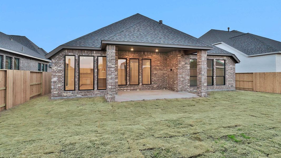 Exterior details and patio area of a home in Meridiana, Manvel (Image 4).