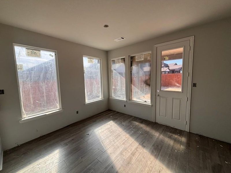 Unfurnished dining area featuring hardwood / wood-style floors Unfurnished dining area featuring hardwood / wood-style floors