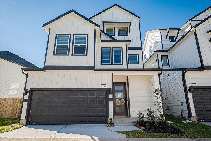 Front exterior of a new home in Regents Court, Houston, TX, highlighting curb appeal (Image 1).