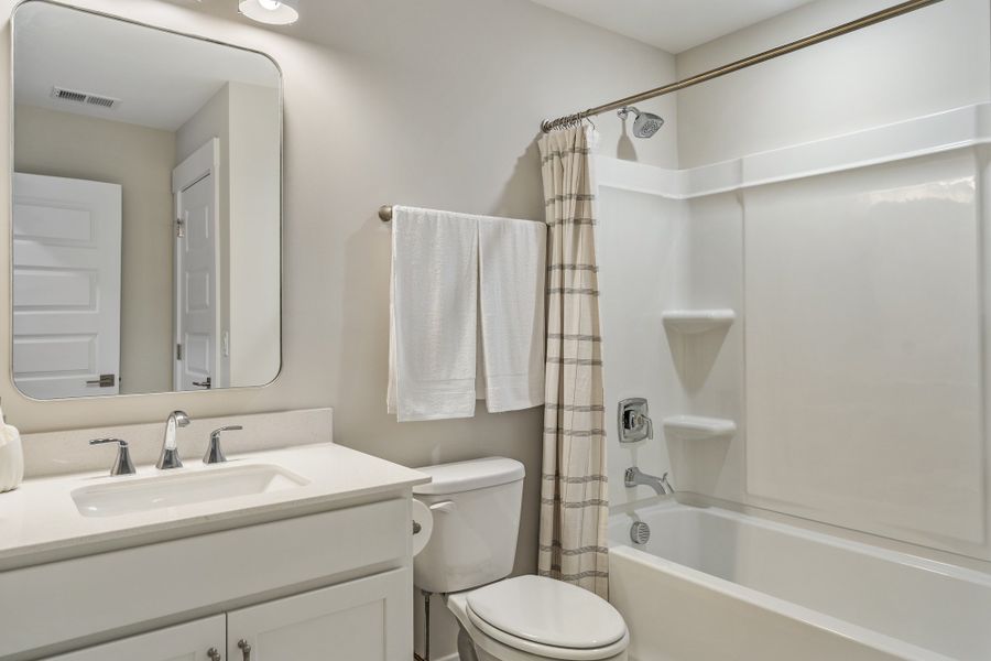 Representative furnished interior of a home built from the Whitmore by Hunter Quinn Homes in Walker's Pointe, Anderson (Image 28).