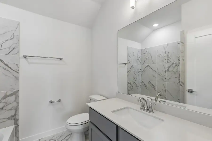 Bathroom in the Claret home plan by Trophy Signature Homes – REPRESENTATIVE PHOTO