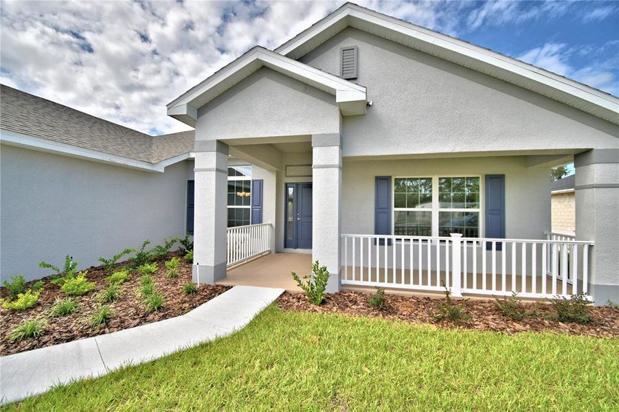 Exterior details and patio area of a home in Cadence Crossing, Auburndale (Image 31).