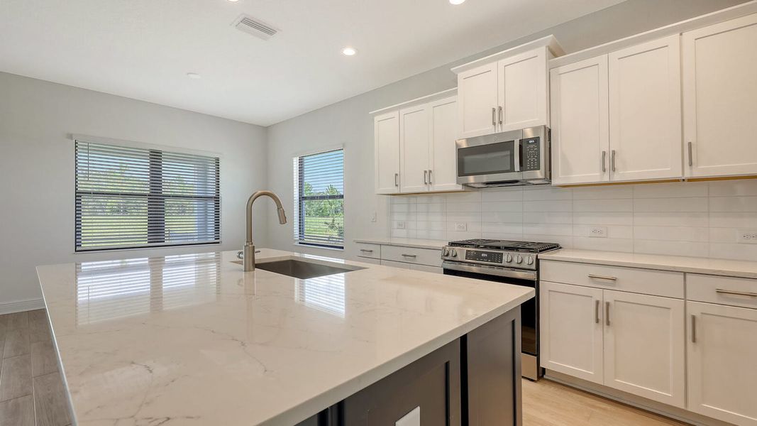 Furnished interior view inside a new home in Palm Grove Real Estate and Homes for Sale in Lakewood Ranch, FL - Neal Communities, Lakewood Ranch (Image 11).