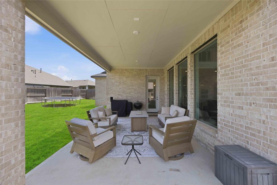Extend your living outdoors with a spacious covered patio designed for effortless entertaining and year-round enjoyment.