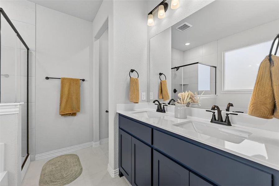 Bathroom with a stall shower and double vanity Bathroom with a stall shower and double vanity