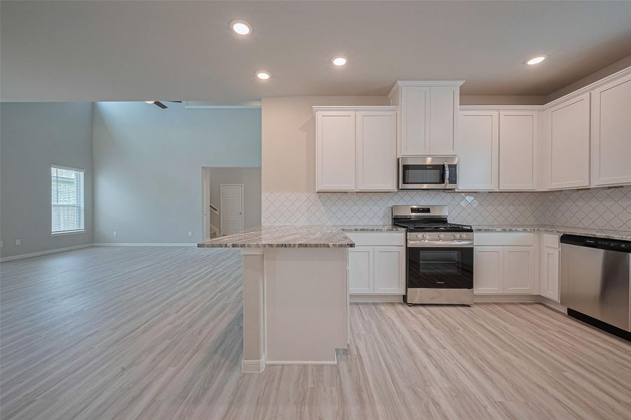 Furnished interior view inside a new home in Sunterra, Katy (Image 4).