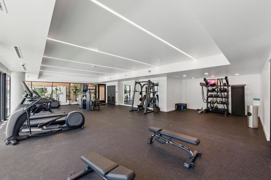 Fitness facility with varied equipment and generous space for all workout routines.