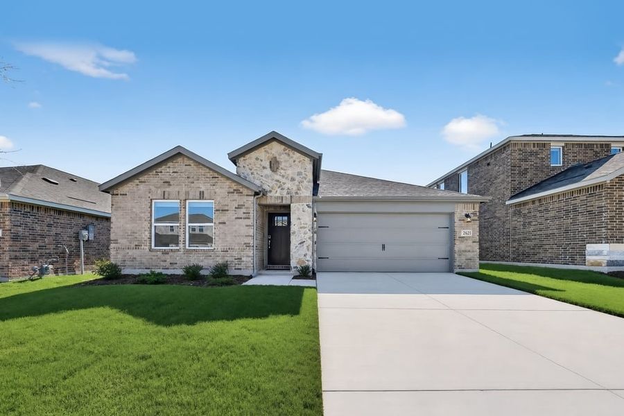 Front exterior of a new home in Parks at Foster Crossing, Anna, TX, highlighting curb appeal (Image 1). Front exterior of a new home in Parks at Foster Crossing, Anna, TX, highlighting curb appeal (Image 1).