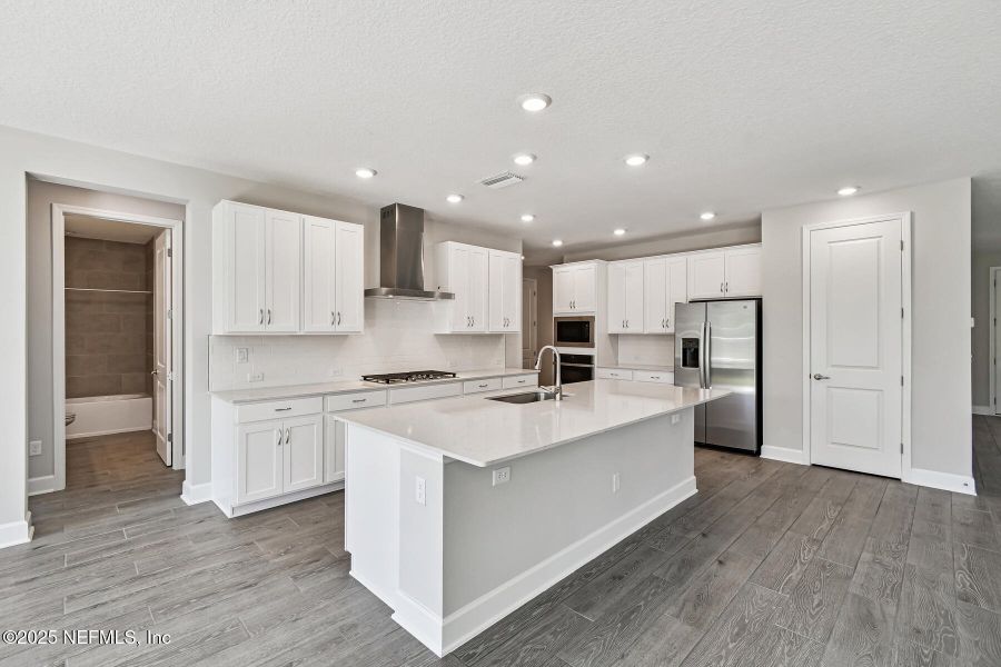 Furnished interior view inside a new home in Tributary 70', Yulee (Image 3).