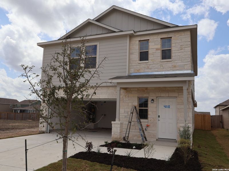Front exterior of a new home in Park Place, New Braunfels, TX, highlighting curb appeal (Image 1). Front exterior of a new home in Park Place, New Braunfels, TX, highlighting curb appeal (Image 1).