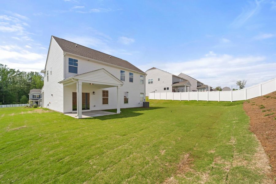 Front exterior of a new home in Cottages at Piper Village, Trinity, NC, highlighting curb appeal (Image 24).