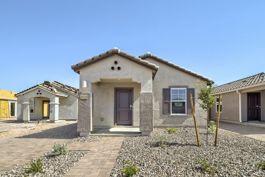 Front exterior of a new home in Anderson Farms, Maricopa, AZ, highlighting curb appeal (Image 1). Front exterior of a new home in Anderson Farms, Maricopa, AZ, highlighting curb appeal (Image 1).