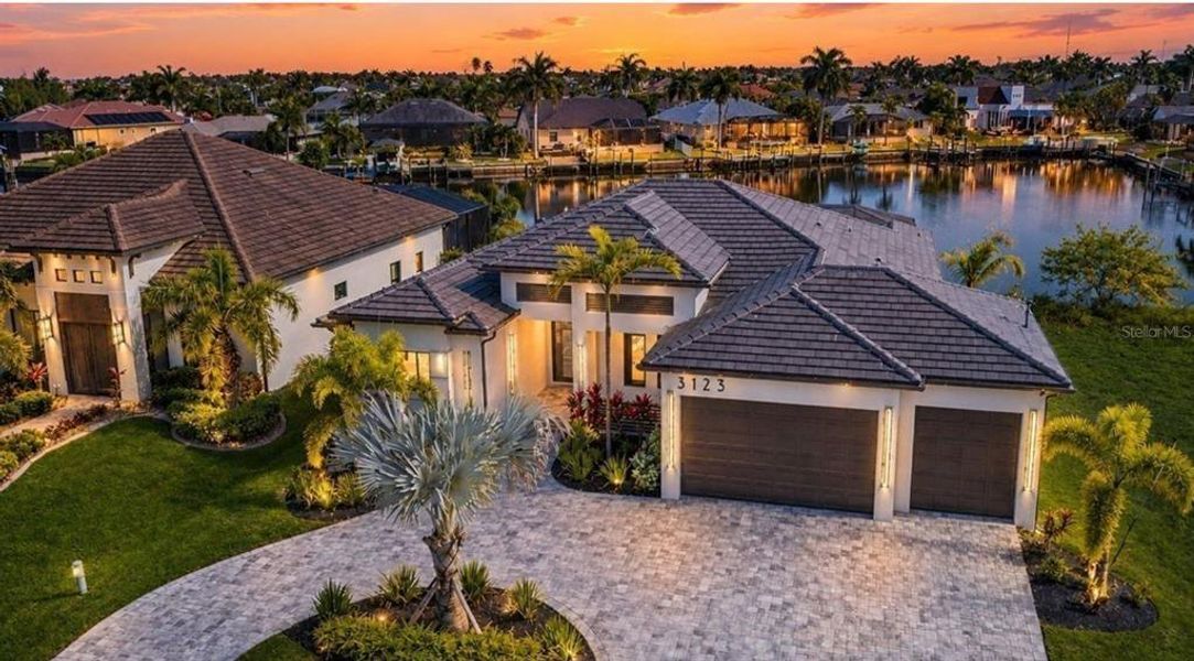 Front exterior of a new home in , Cape Coral, FL, highlighting curb appeal (Image 2). Front exterior of a new home in , Cape Coral, FL, highlighting curb appeal (Image 2).