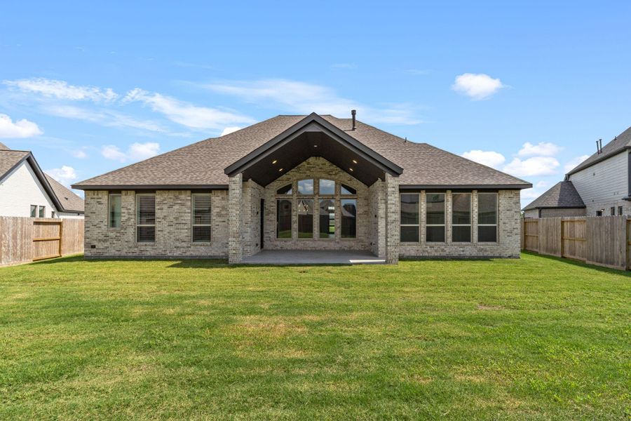 Front exterior of a new home in Riceland 70', Mont Belvieu, TX, highlighting curb appeal (Image 24).