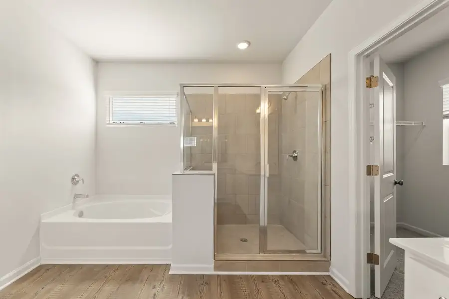 A bathroom with a glass shower. A bathroom with a glass shower.