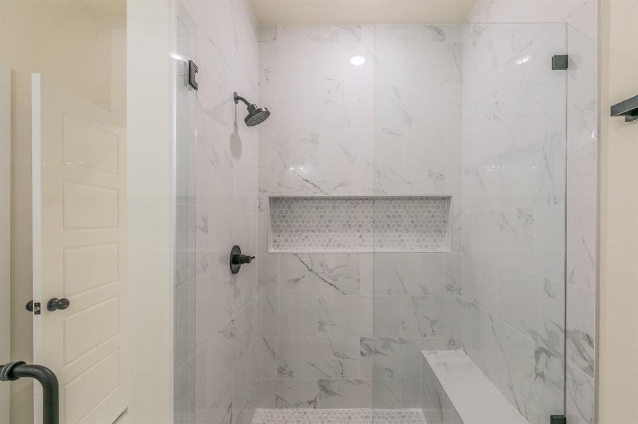 Bathroom featuring a shower with shower door