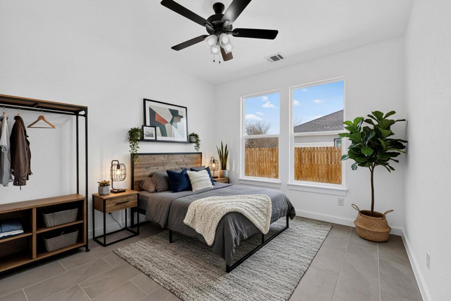 Bedroom featuring a ceiling fan and light tile patterned floors